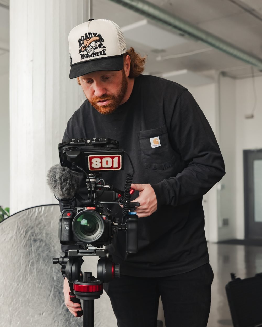 Casey, co-founder and creative director, behind a camera