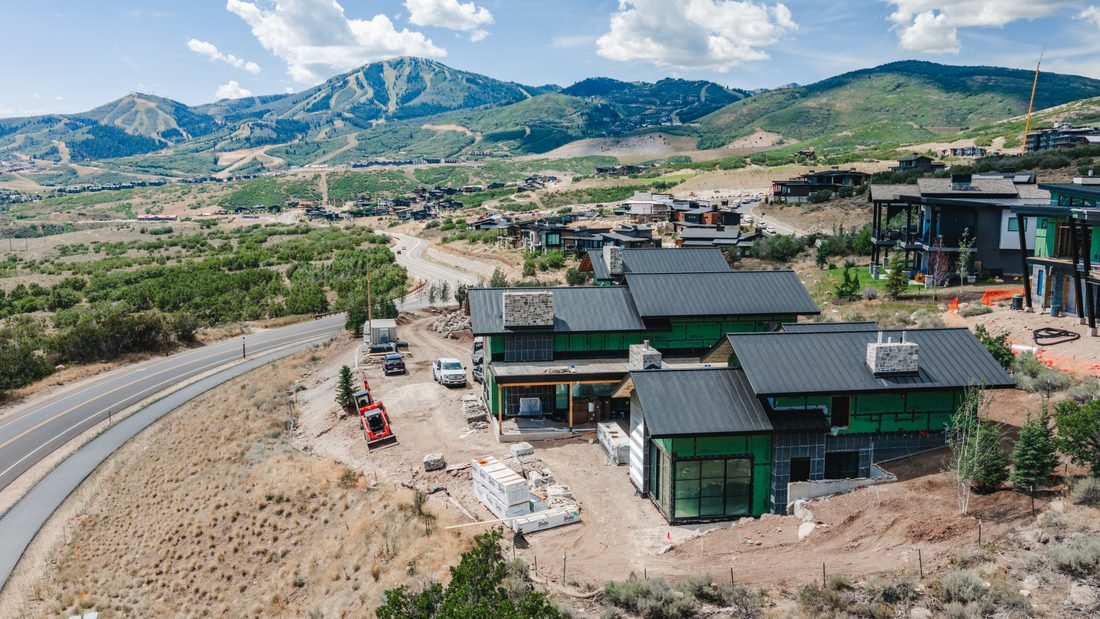 Aerial view of new homes below the mountains