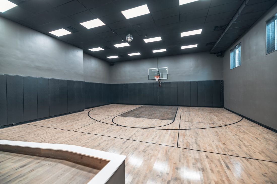 Indoor basketball court with a padded surround