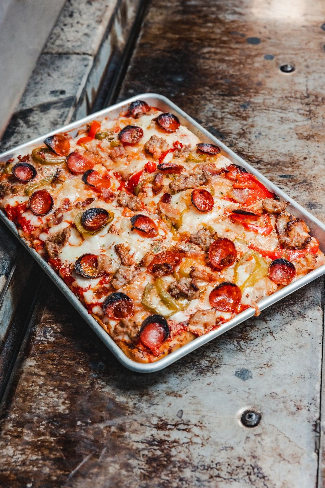 Tray baked pizza shot from above